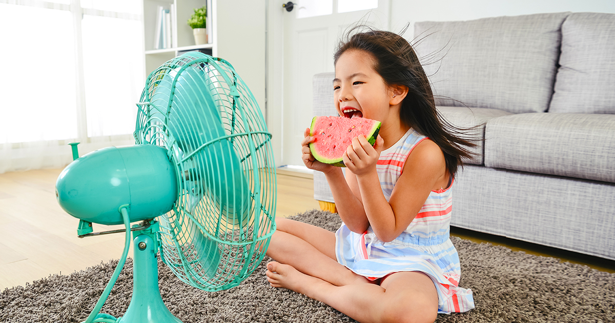 girl at home stays cool while eating watermelon 