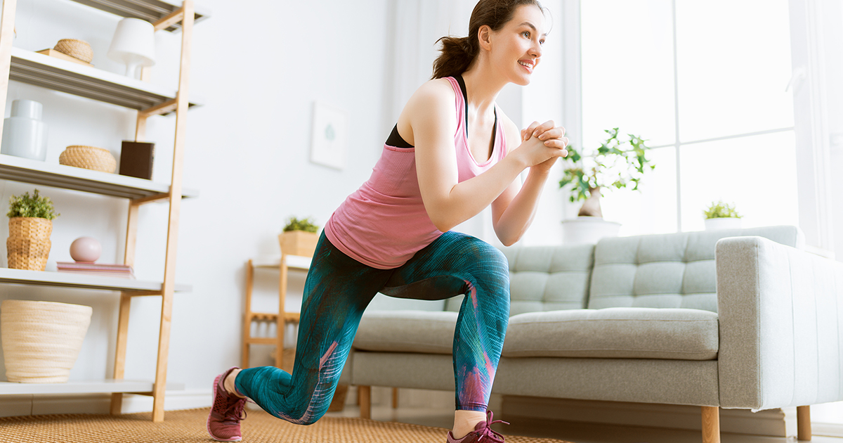 woman does lunge exercise at home