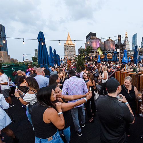 employees enjoying a rooftop party