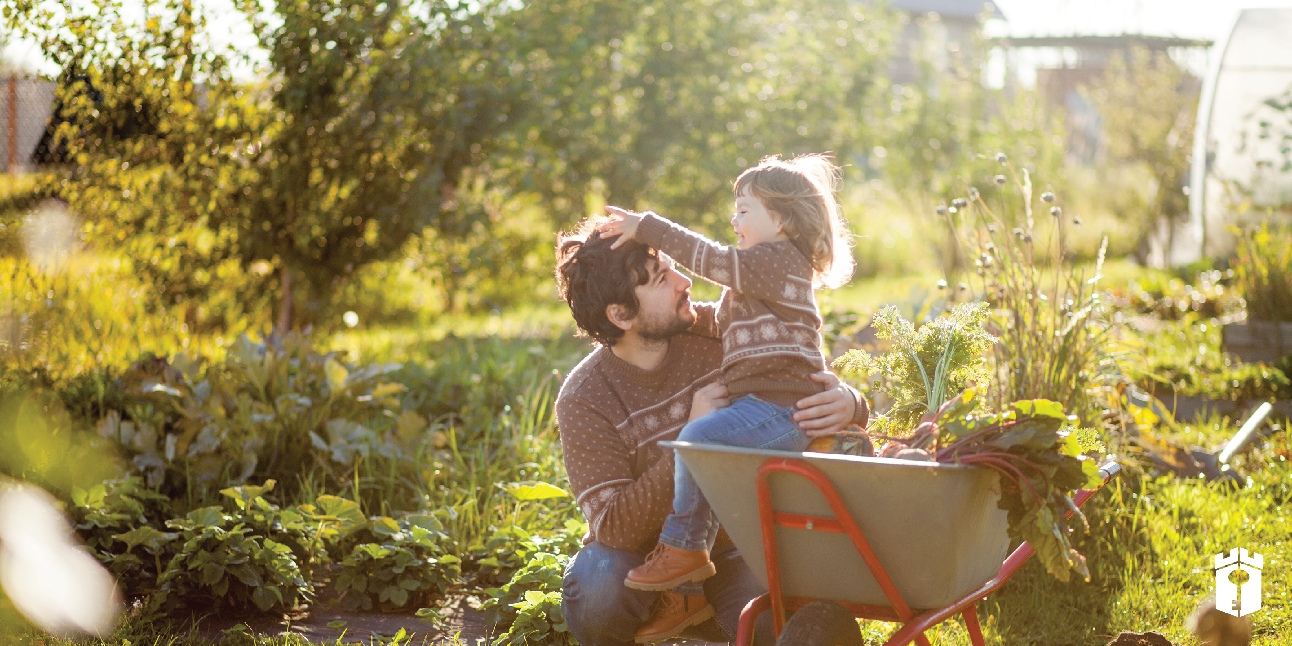 father and daughter play in autumn home garden