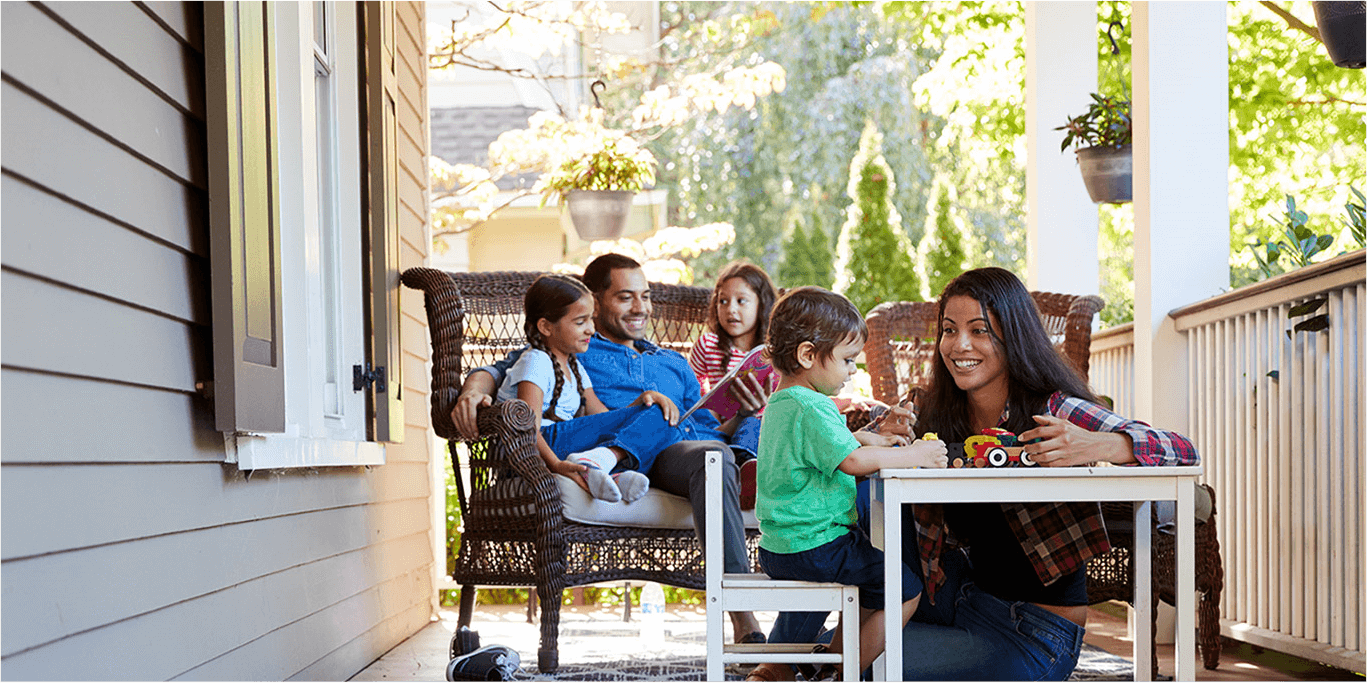 family playing on porch with children